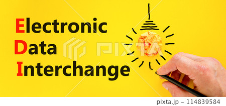 EDI electronic data interchange symbol. Concept words EDI electronic data interchange on yellow paper. Beautiful yellow background. Business and EDI electronic data interchange concept. Copy space. 114839584