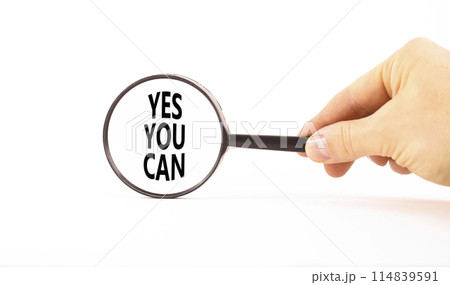 Motivational Yes you can symbol. Concept words Yes you can in beautiful magnifying glass. Beautiful white table background. Businessman hand. Business motivational and Yes you can concept. Copy space Motivational Yes you can symbol. Concept words Yes you can in beautiful magnifying glass. Beautiful white table background. Businessman hand. Business motivational and Yes you can concept. Copy space 114839591