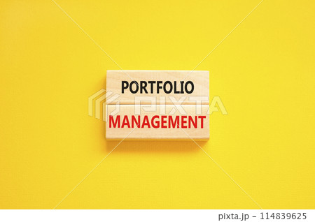 Portfolio management symbol. Concept words Portfolio management on beautiful wooden block. Beautiful yellow paper background. Business Portfolio management concept. Copy space. 114839625