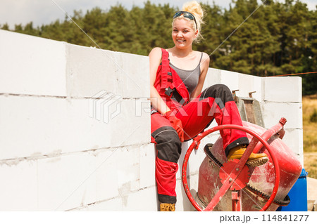 Strong woman working with construction site Strong woman working with construction site 114841277