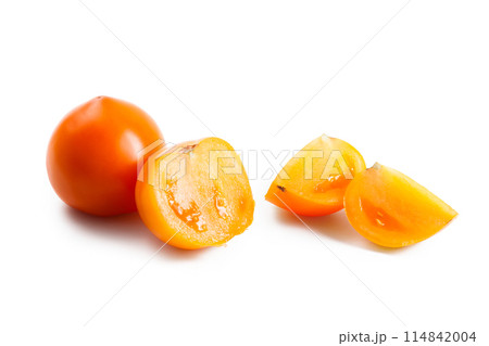 Cut and whole of yellow tomato isolated on white background. Cut and whole of yellow tomato isolated on white background. 114842004