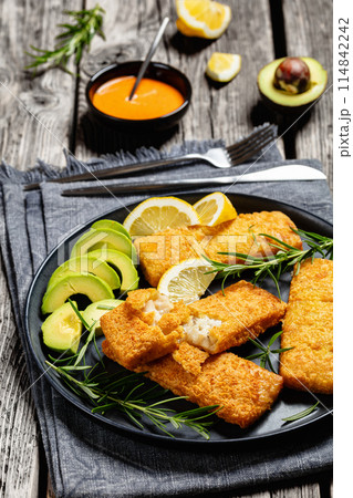 crispy baked battered pollock fillet on a plate crispy baked battered pollock fillet on a plate 114842242