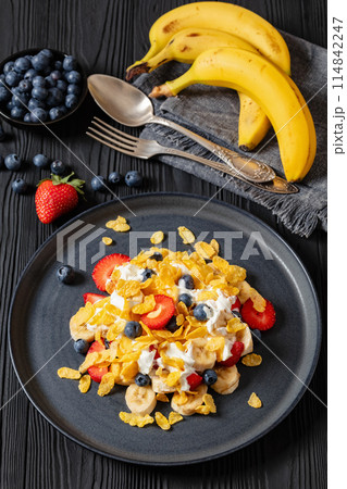 fresh berries, banana with corn flakes and yogurt fresh berries, banana with corn flakes and yogurt 114842247