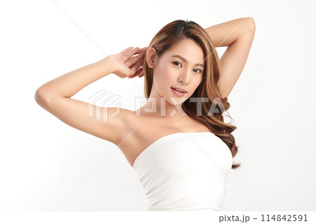 Beautiful Young Asian woman lifting hands up to show off clean and hygienic armpits or underarms on white background, Smooth armpit cleanliness and protection concept 114842591