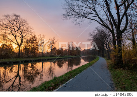 Sunset Glow along the Riverside Path Sunset Glow along the Riverside Path 114842806