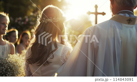 Girl with Priest During First Communion Ceremony - A Moment of Spiritual Significance 114843091