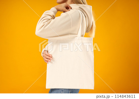A young woman in a white coat with a hood 114843611