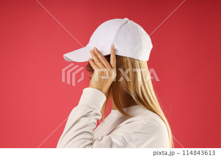 A young woman in a white sweater A young woman in a white sweater 114843613