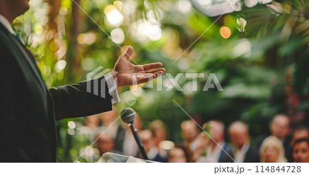 best man making speech at wedding ceremony celebration, friend or emcee speaking in microphone at holiday or birthday, happy male in suit toasting 114844728
