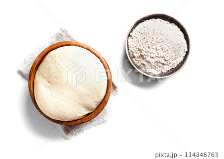 Sourdough or yeast dough and bowl of flour Sourdough or yeast dough and bowl of flour 114846763