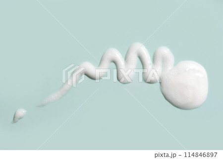 Cosmetic cream gel texture on green background Cosmetic cream gel texture on green background 114846897