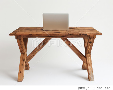 A minimalist style wooden table, featuring an open laptop placed on the surface. A minimalist style wooden table, featuring an open laptop placed on the surface. 114850332