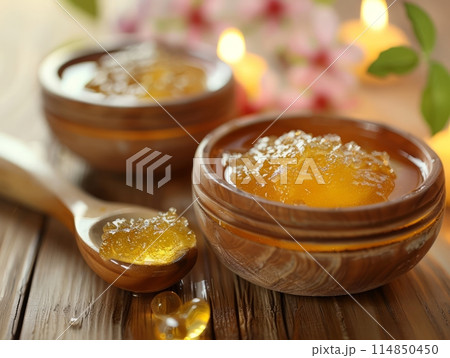Yellow bowl filled with sweet honey, ready for dipping Yellow bowl filled with sweet honey, ready for dipping 114850450