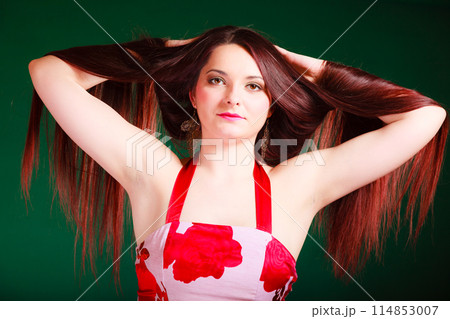 Long haired woman creating coiffure. Long haired woman creating coiffure. 114853007