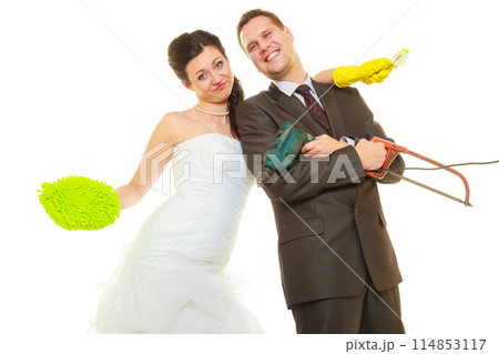 Bride and groom sharing household duties Bride and groom sharing household duties 114853117