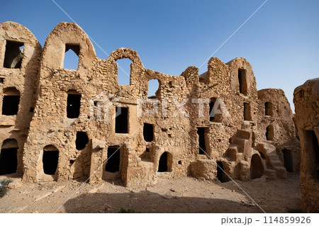 Uninhabited fortified village with houses and granaries, Tunisia. Ksar of Mgabla, Berber, Tataouine. Uninhabited fortified village with houses and granaries, Tunisia. Ksar of Mgabla, Berber, Tataouine. 114859926