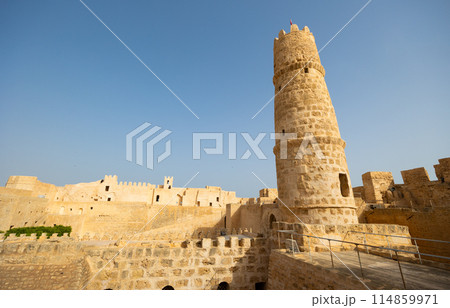 Monastir in Tunisia is an ancient city and popular tourist destination on Mediterranean Sea. Landscape view of main fortress of city Monastir in Tunisia is an ancient city and popular tourist destination on Mediterranean Sea. Landscape view of main fortress of city 114859971