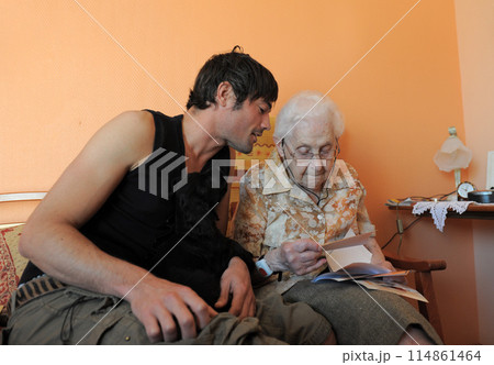 old grand mother and her grandson 114861464