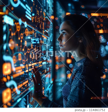 A woman works with a digital panel in a high-tech laboratory, surrounded by data and graphs. A woman works with a digital panel in a high-tech laboratory, surrounded by data and graphs. 114861752