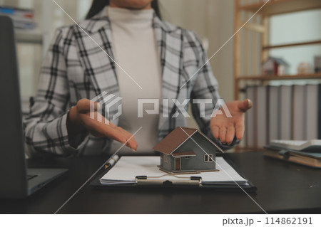 buy or sell real estate mortgage, Sale representative offer house purchase contract to buy a house or apartment and mortgage Money and Financial Concepts buy or sell real estate mortgage, Sale representative offer house purchase contract to buy a house or apartment and mortgage Money and Financial Concepts 114862191