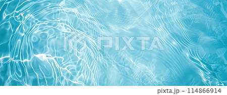 Ripples and light reflections on clear blue water surface banner background texture with copy space 114866914