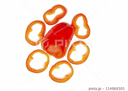 Red sweet ripe pepper cut into circles,slices on white 114868301