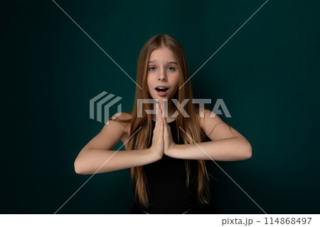Young Girl Making a Surprised Face With Her Hands Young Girl Making a Surprised Face With Her Hands 114868497