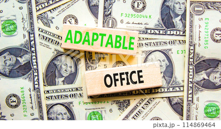 Adaptable office symbol. Concept words Adaptable office on beautiful wooden block. Beautiful dollar bills background. Dollar bills. Business Adaptable office concept. Copy space. 114869464