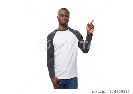 young stylish confident american man dressed casually in a black and white sweatshirt points his young stylish confident american man dressed casually in a black and white sweatshirt points his 114869555