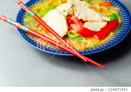 Chicken broth with ginger and black fungus mushrooms, high protein wheat noodles, sliced steamed chicken breast, julienne carrot 114871451