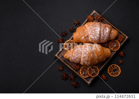 Delicious crispy golden croissant with chocolate filling 114872631