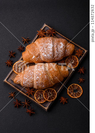 Delicious crispy golden croissant with chocolate filling 114872632