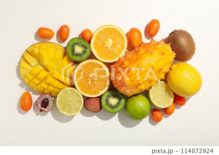 Set of tropical fruits on white background, top view Set of tropical fruits on white background, top view 114872924