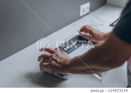 man vacuum-packing cheese with a vacuum cleaner man vacuum-packing cheese with a vacuum cleaner 114873234