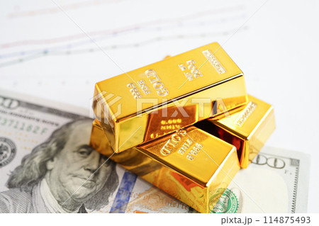 Gold bars on US dollar banknote money, finance trading investment business currency concept. 114875493