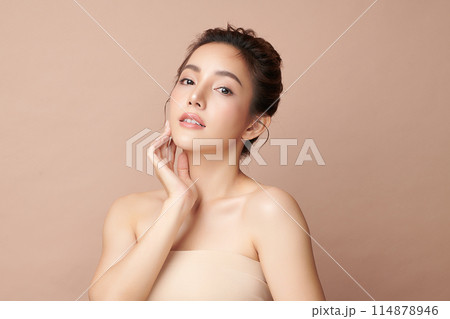 Beautiful young asian woman with clean fresh skin on beige background, Face care, Facial treatment, Cosmetology, beauty and spa, Asian women portrait. 114878946
