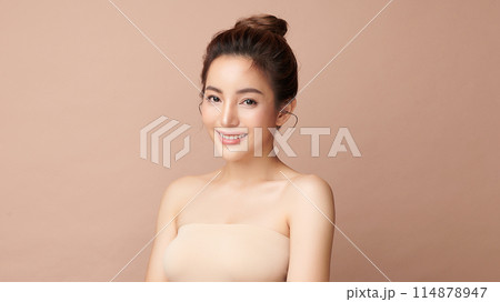 Beautiful young asian woman with clean fresh skin on beige background, Face care, Facial treatment, Cosmetology, beauty and spa, Asian women portrait. 114878947