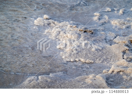 Natural salt formations on a crystalline water surface Natural salt formations on a crystalline water surface 114880013