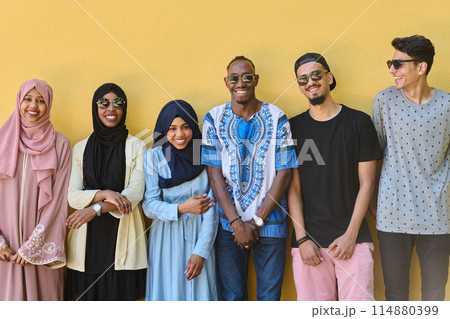 Urban Unity: Vibrant Diversity People in Front of the Yellow Wall 114880399