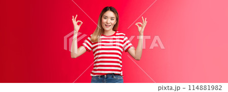 Optimistic good-looking modern asian blond girl show okay fine gesture assure everything ok, smiling broadly, give positive reply, agree good terms, approve excellent effort, red background Optimistic good-looking modern asian blond girl show okay fine gesture assure everything ok, smiling broadly, give positive reply, agree good terms, approve excellent effort, red background 114881982