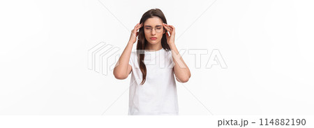 Waist-up portrait of attractive young woman trying get ready, massaging temples with closed eyes as relaxing, ease the pain, thinking rational, put effort into making up plan, white background Waist-up portrait of attractive young woman trying get ready, massaging temples with closed eyes as relaxing, ease the pain, thinking rational, put effort into making up plan, white background 114882190