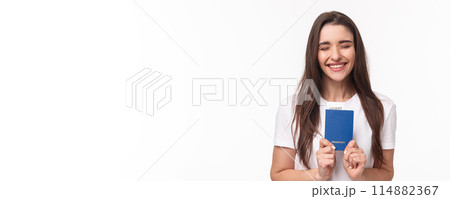Travelling, holidays, summer concept. Portrait of cheerful happy, laughing girl close eyes and smiling enthusiastic, receive her pasport to travel abroad, finally sitting in airport ready for journey Travelling, holidays, summer concept. Portrait of cheerful happy, laughing girl close eyes and smiling enthusiastic, receive her pasport to travel abroad, finally sitting in airport ready for journey 114882367