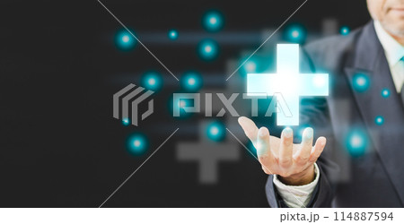 A man is holding a cross in his hand, surrounded by a lot of dots 114887594