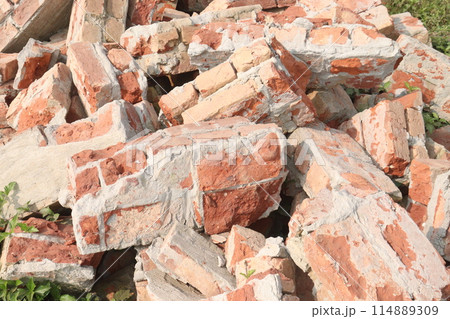 Pile Of Broken Red Bricks 114889309