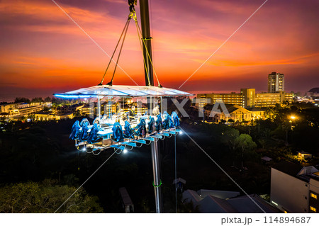 Aerial view of a dinner in the sky in Karon, Phuket, Thailand Aerial view of a dinner in the sky in Karon, Phuket, Thailand 114894687