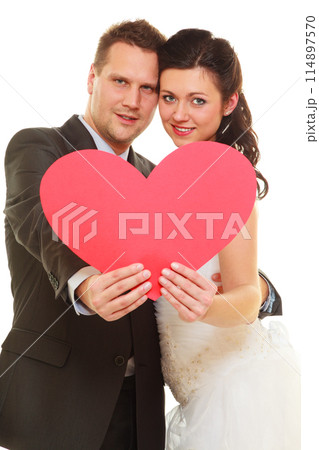 Groom and bride couple holding heart Groom and bride couple holding heart 114897570