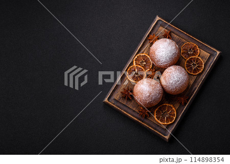 Round homemade cheese donuts glazed with citrus flavor 114898354