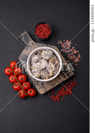Boiled chicken hearts cut into slices with onions and cream sauce Boiled chicken hearts cut into slices with onions and cream sauce 114898401