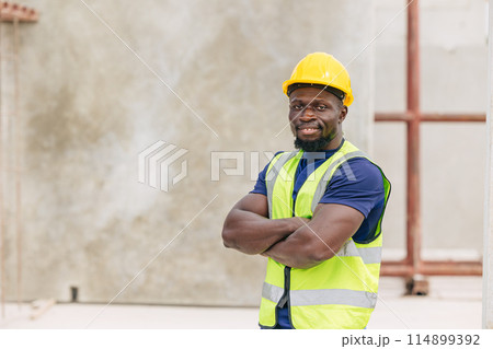 Portrait happy smiling African black smart engineer worker foreman supervisor working outdoor in Precast concrete casting industry 114899392