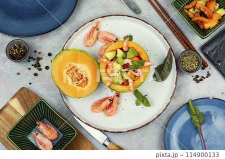 Fruit salad with melon and prawns. Fruit salad with melon and prawns. 114900133